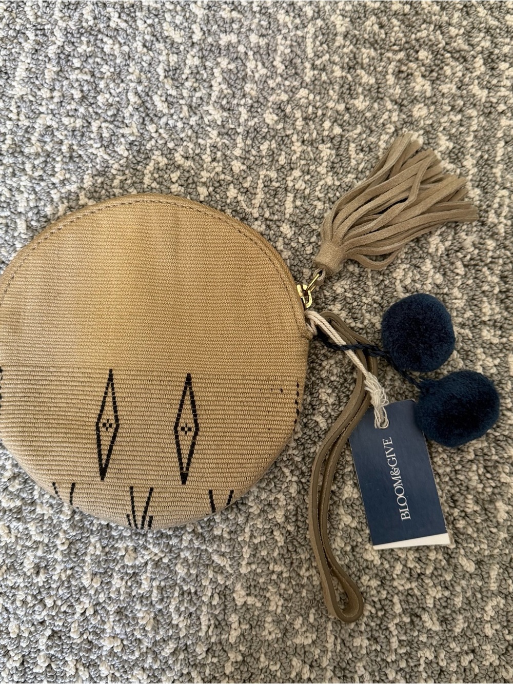 Bloom & Give Tan Round Mini Wristlet with Tassel & Pom Pom’s